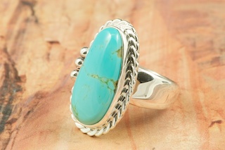 Genuine Manassa Turquoise set in Sterling Silver Ring. This Turquoise is also referred to as King�s Manassa Turquoise. The Manassa Turquoise mine is located in Manassa, Conejos County, Colorado. Created by Navajo Artist Tony Garcia. Signed by the artist.